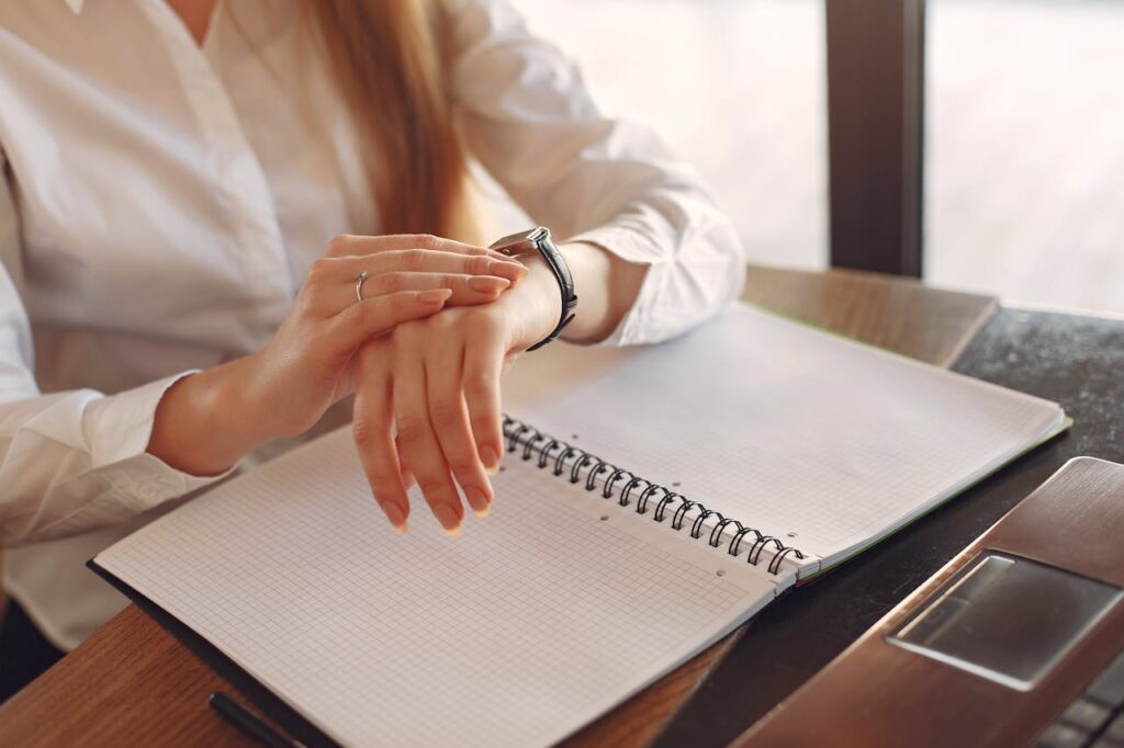 A woman checking her watch with no worries since getting a first responder home loan works around her schedule. 