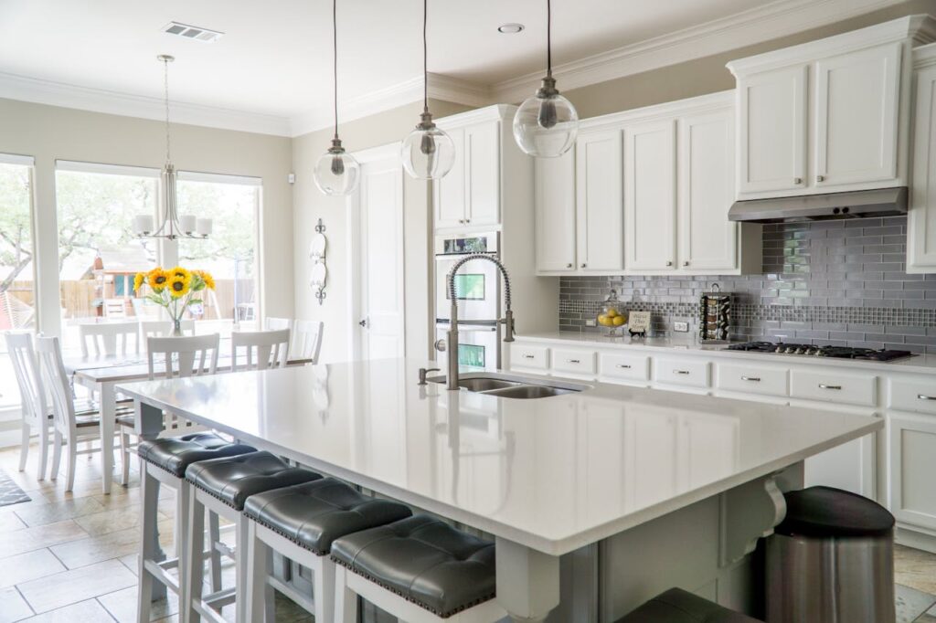 A bright and airy kitchen with a large island in the middle inside a home that was financed with home loans for healthcare workers.