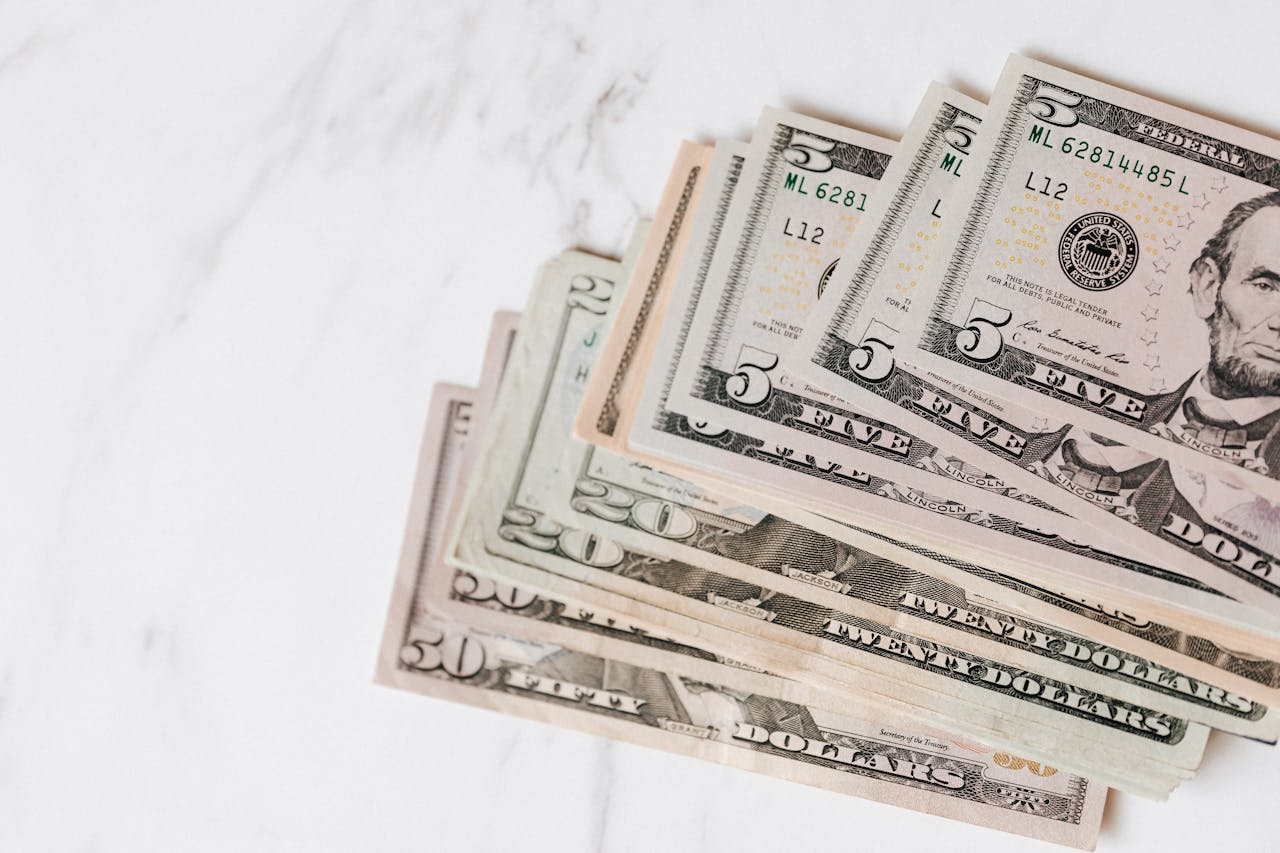 A stack of cash from a cash-out refinance or home equity loan.