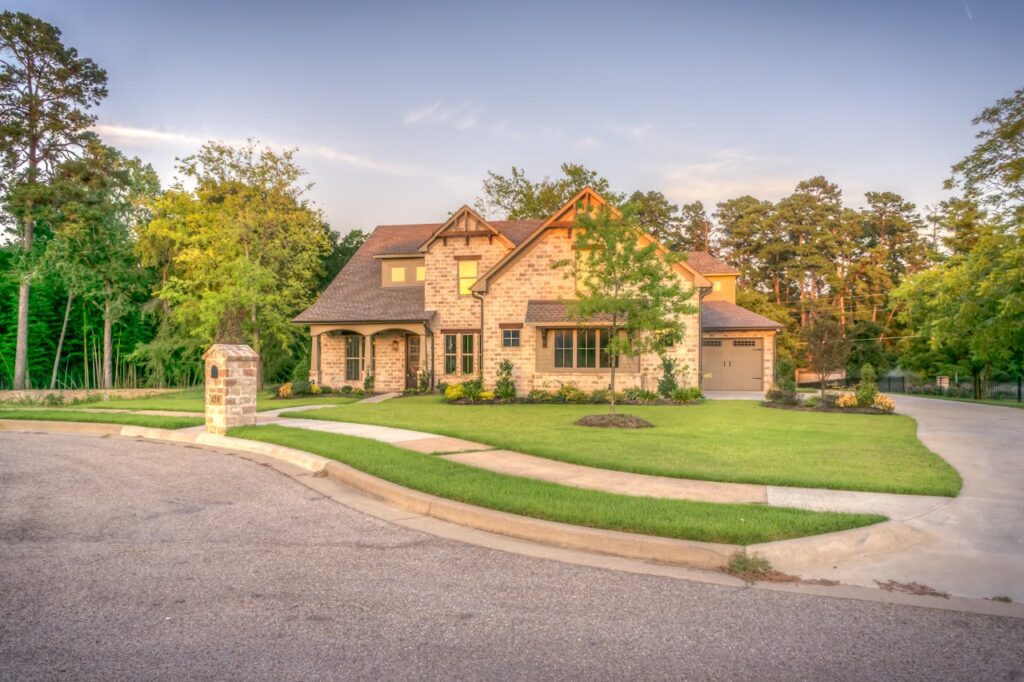 A brown brick colonial home that was purchased using jumbo loan Georgia options. 