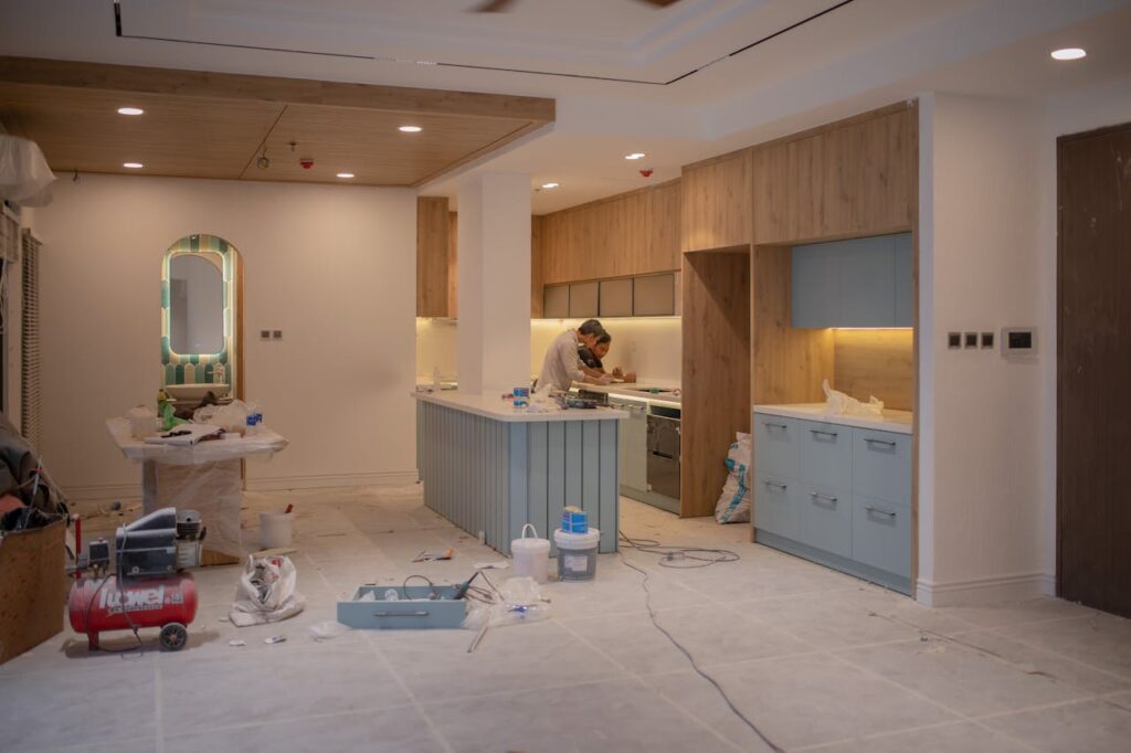 Two people are renovating a kitchen with a fix-and-flip loan, which is an alternative to a DSCR loan Washington for real estate investors. 