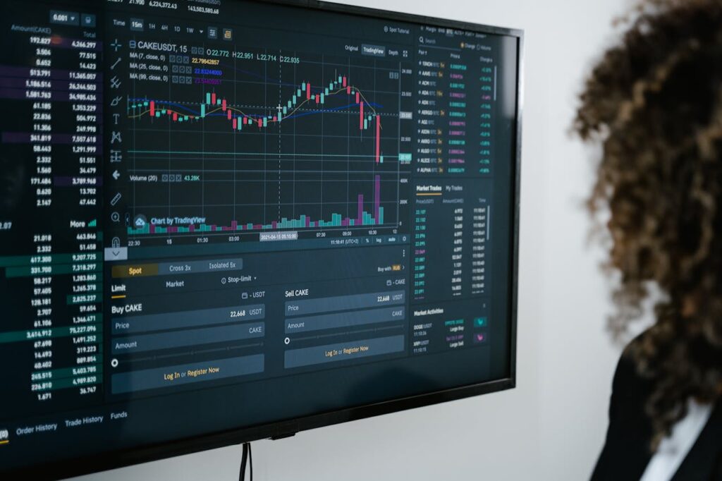 A woman is looking at a fluctuating graph of mortgage interest rates to predict the next Federal Reserve interest rate cuts. 